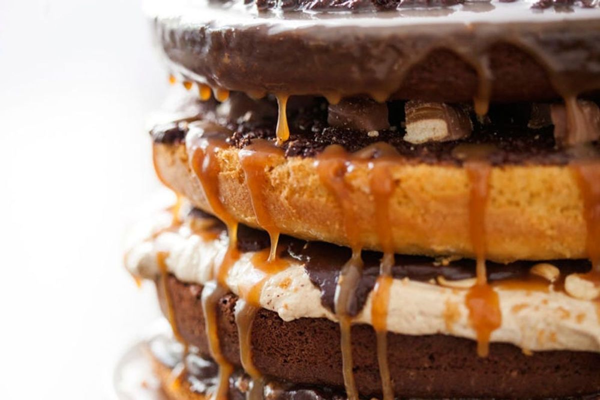 Introducing Our Candy Bar Cake! Four Layers of Twix, Snickers, Heath Bars, and Rolos Galore!